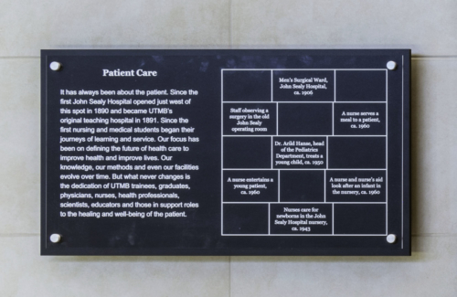 Close up photo of the 'Patient Care' description plaque that describes the importance of patient care through UTMB's history. This plaque also labels all of the historical photos in the accompanying history panel.